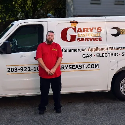 The company's own service van, lettered with their logo and phone number, blurred here as background atmosphere